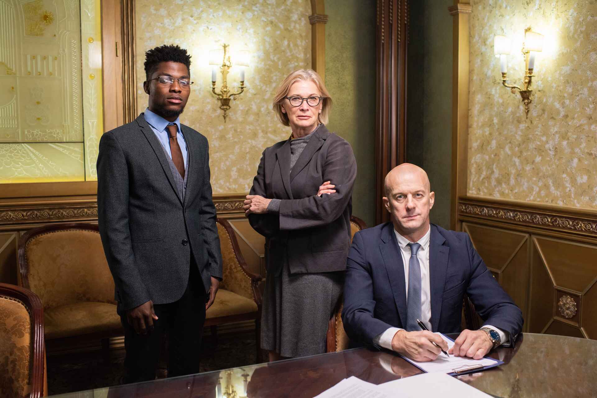 Group of lawyers standing by workplace