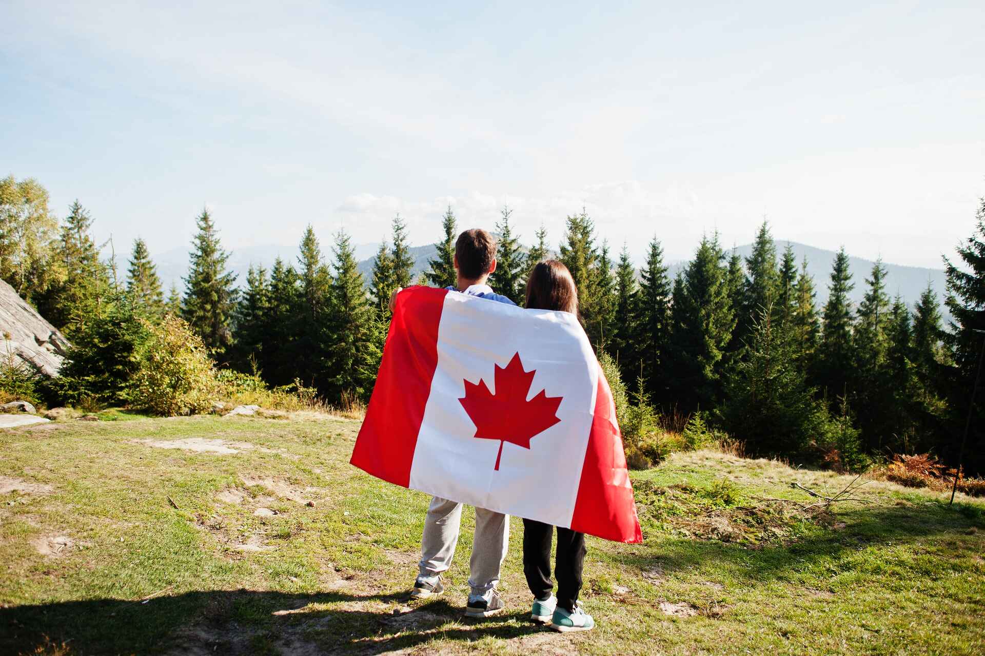 couple with large canadian flag