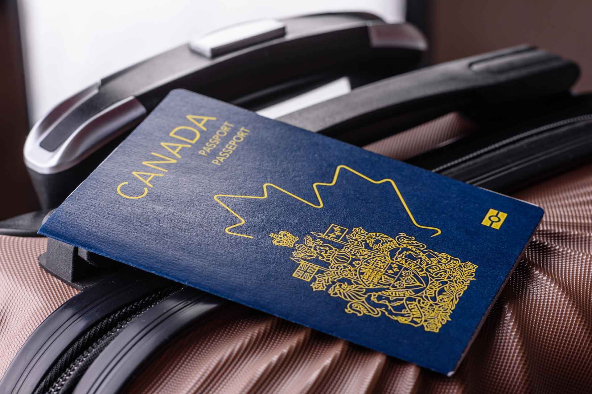 canadian passport on suitcase