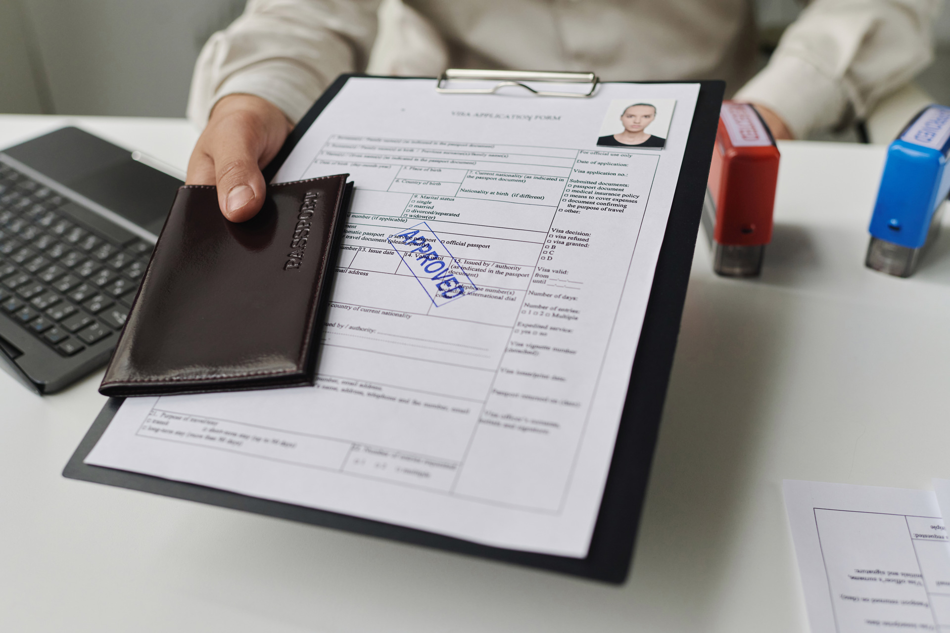 Approved visa application with passport
