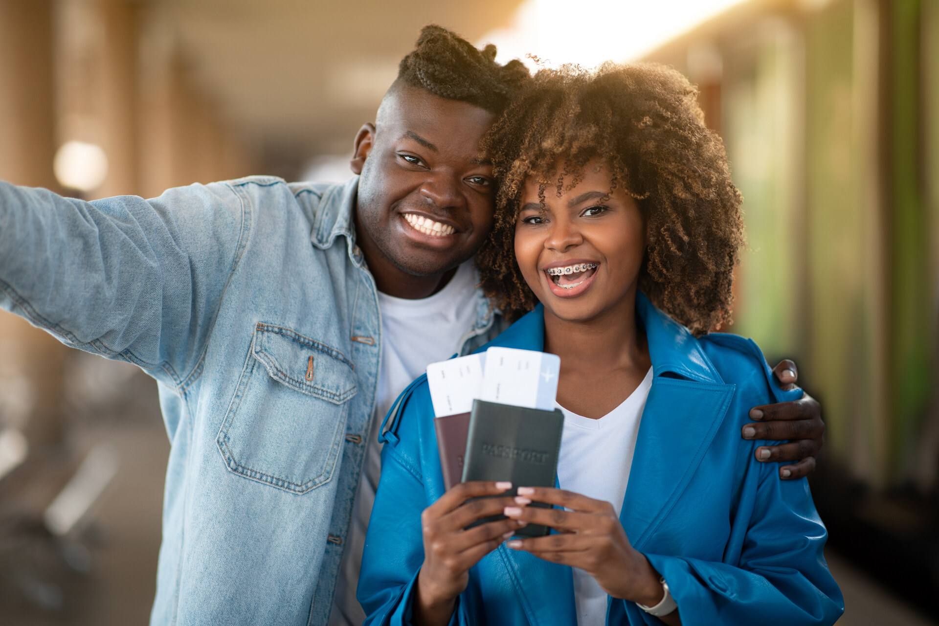 Happy couple with passports and tickets