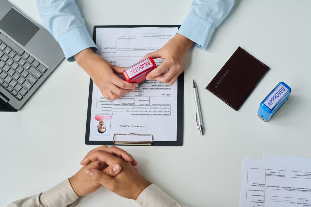 Visa application form being stamped ‘Rejected’