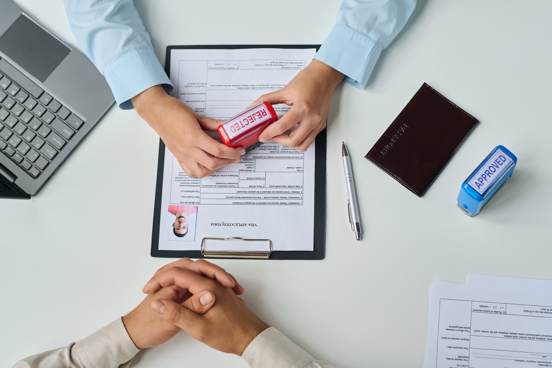 Visa application form being stamped ‘Rejected’
