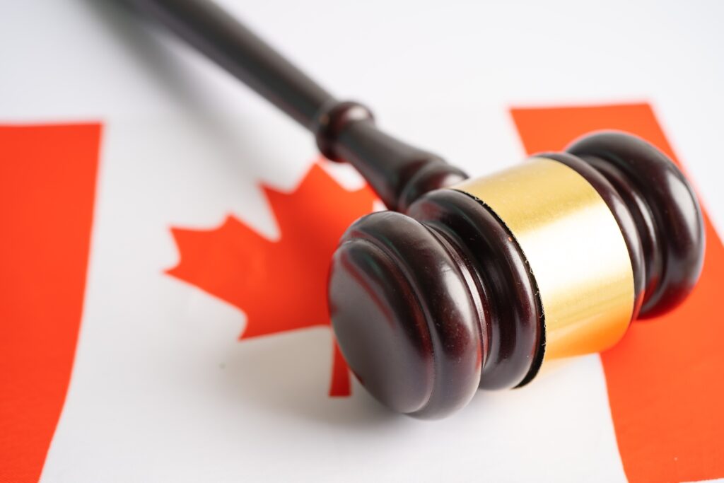 Judge’s gavel placed on Canadian flag