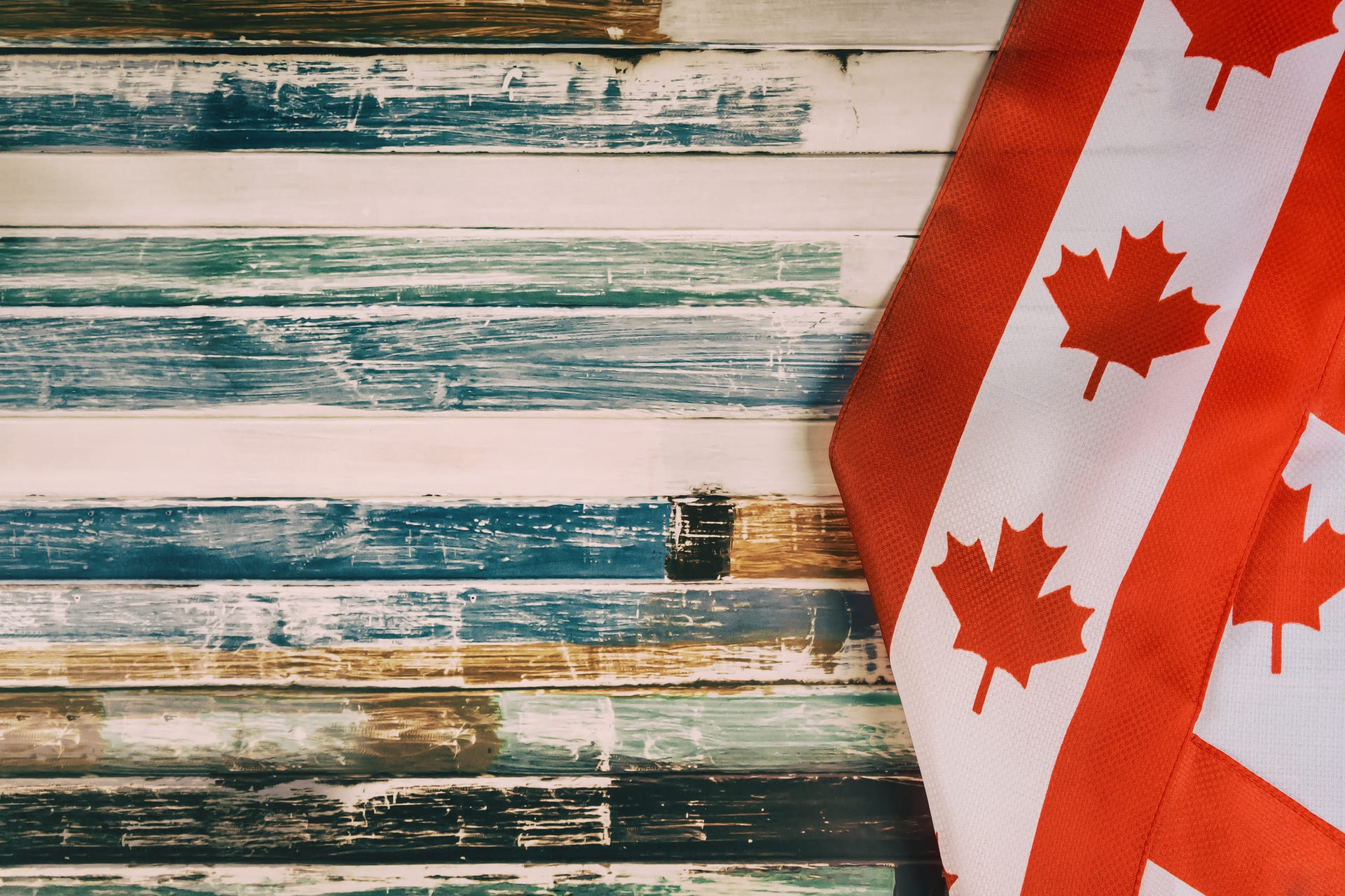 Canadian flag fabric on rustic wooden boards