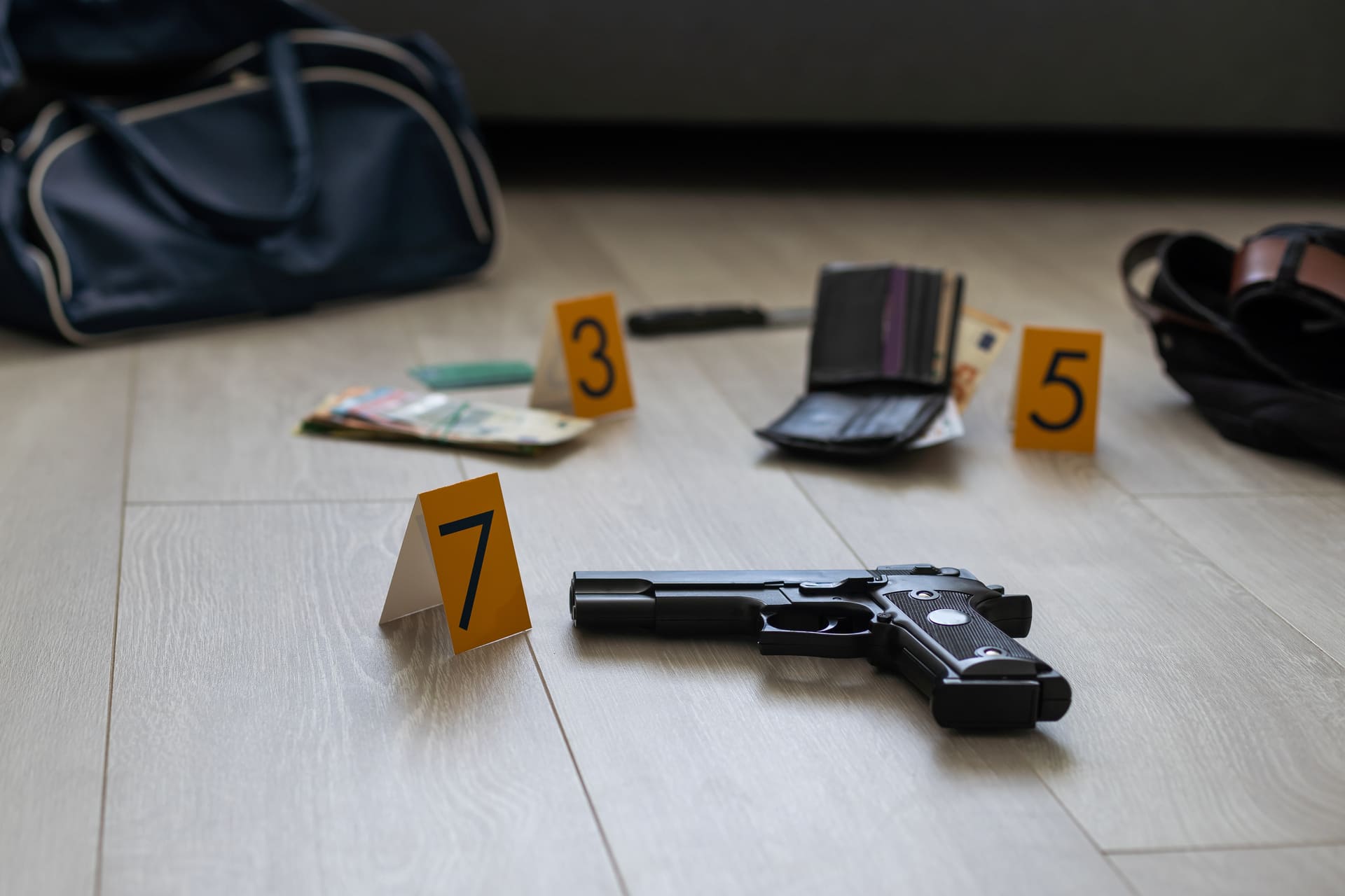 Crime scene evidence markers and handgun