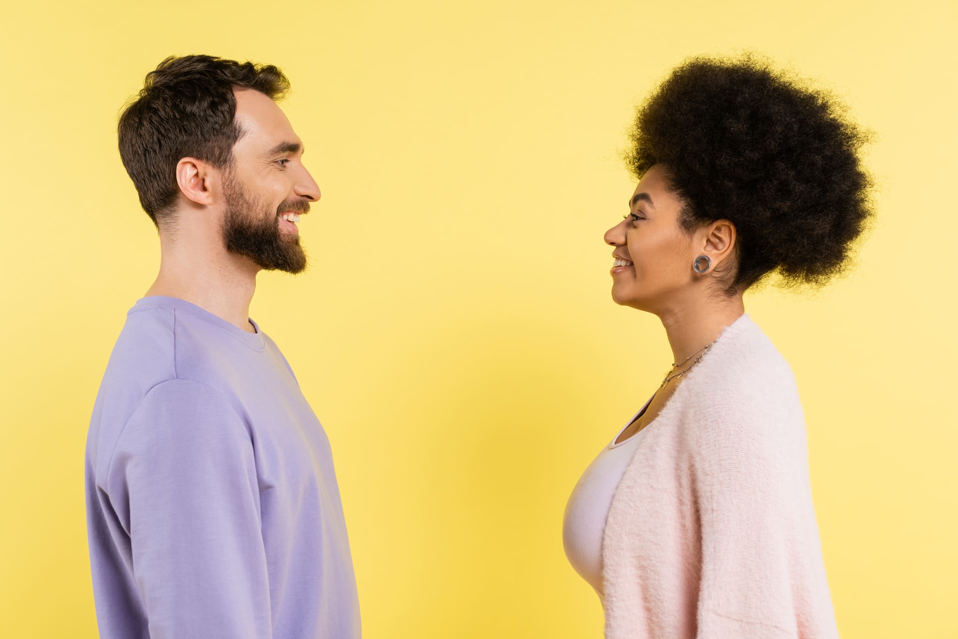Side-by-side view of two people looking at each other