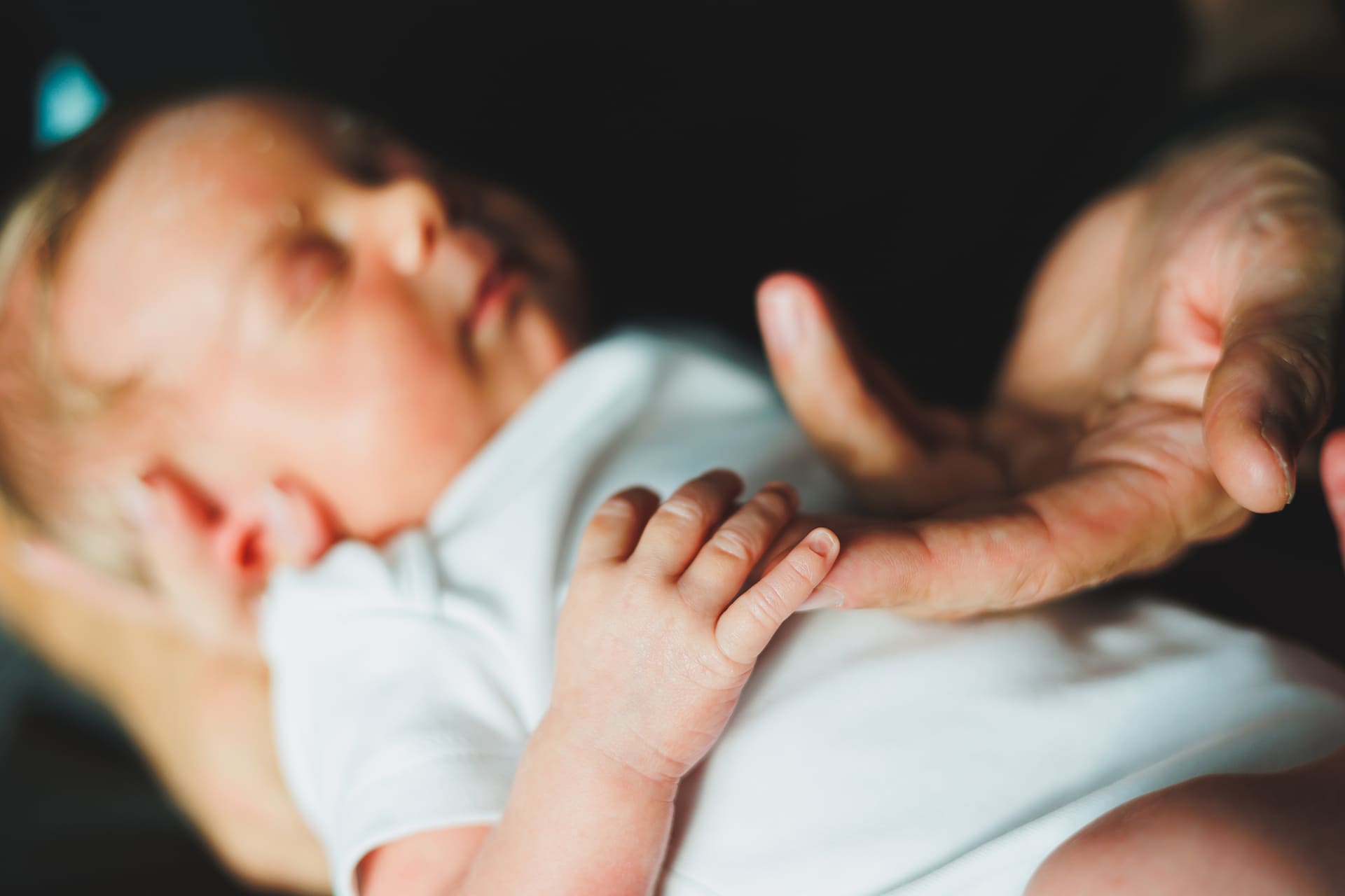 Picture of parent holding newborn baby