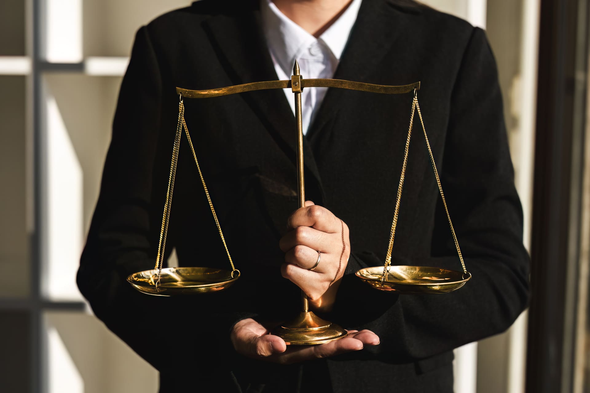 lawyer holding scales of justice