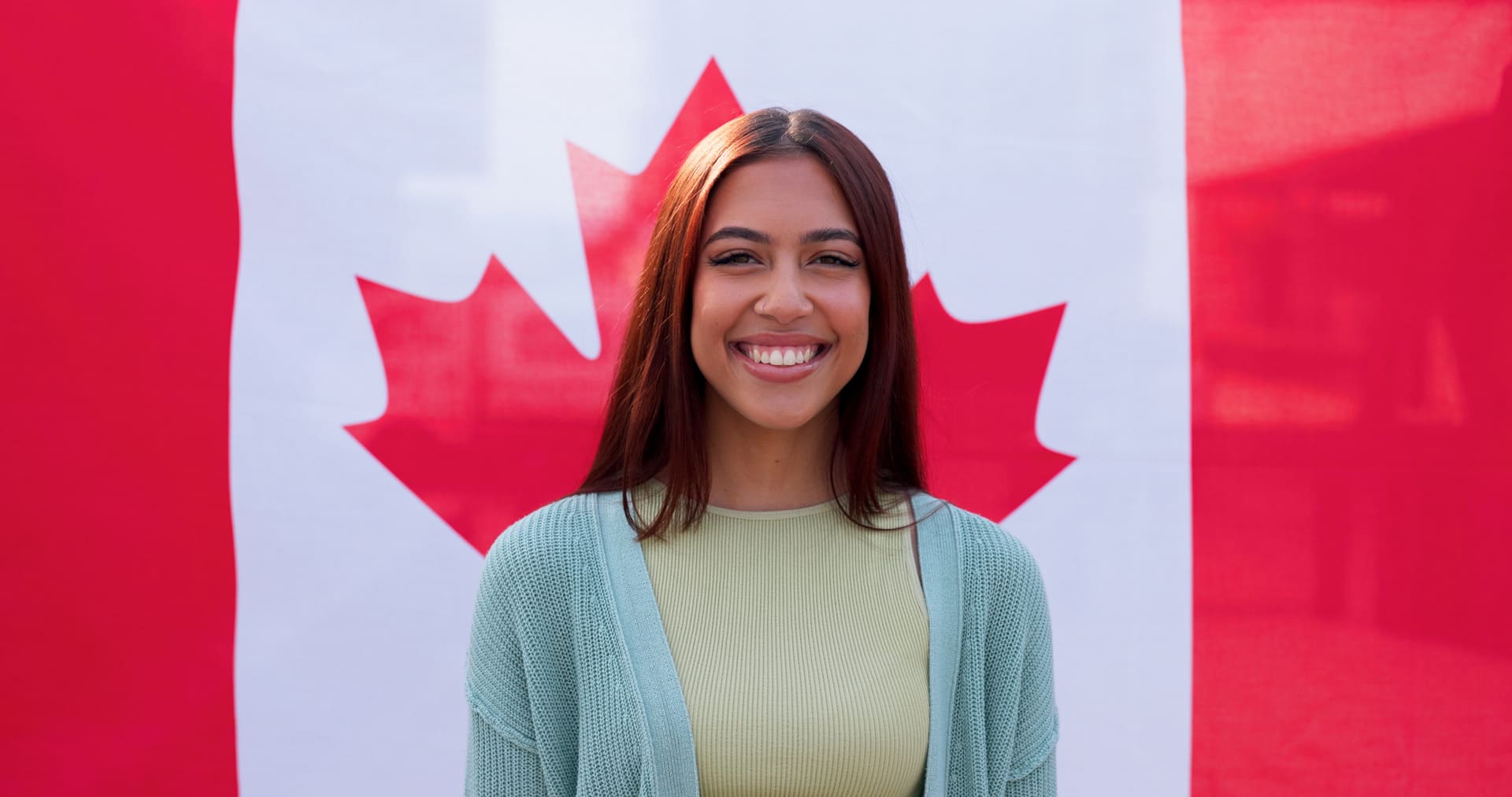 woman in front of canadian flag