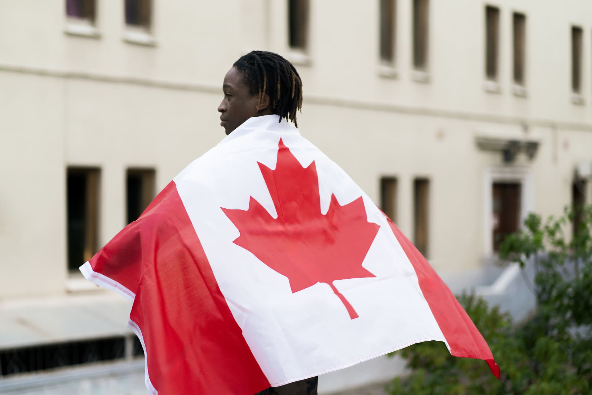 black male with flag on back