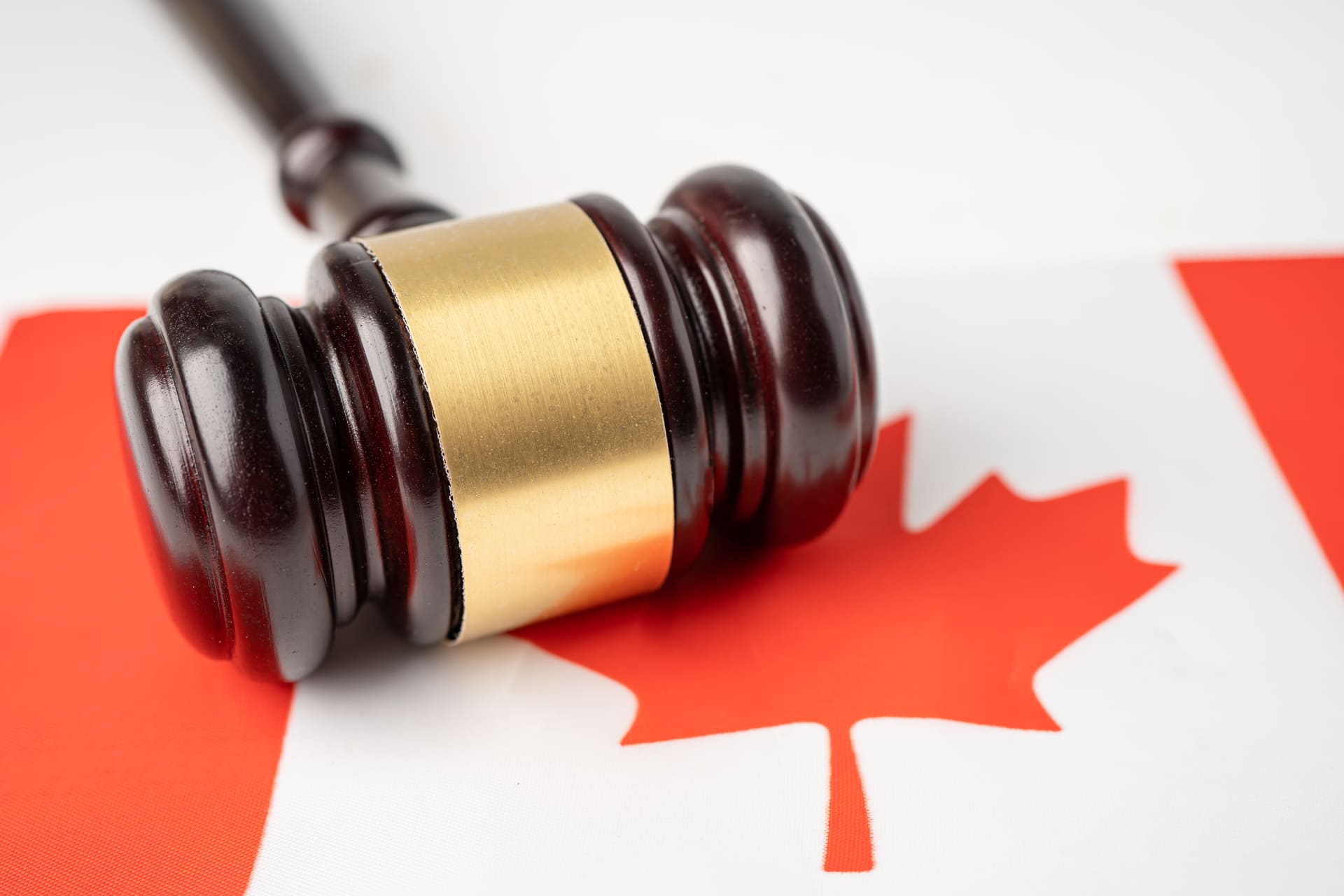 gavel-on-canadian-flag-symbolizes-law-and-justice