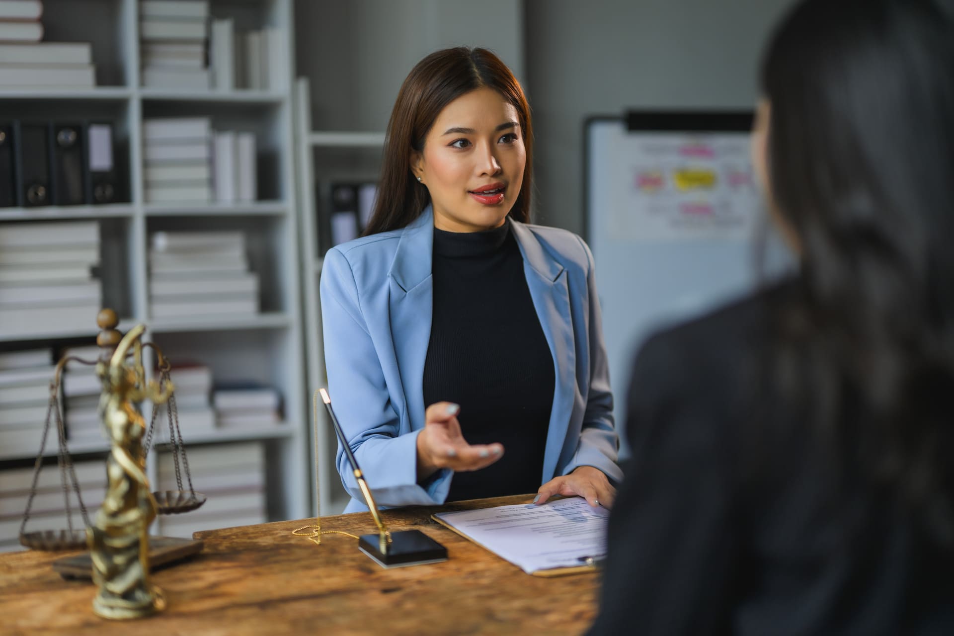 lawyer-advising-client-during-meeting-in-office