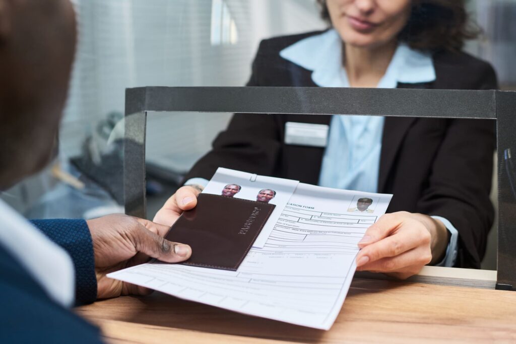 middle-aged-woman-handing-documents-to-man