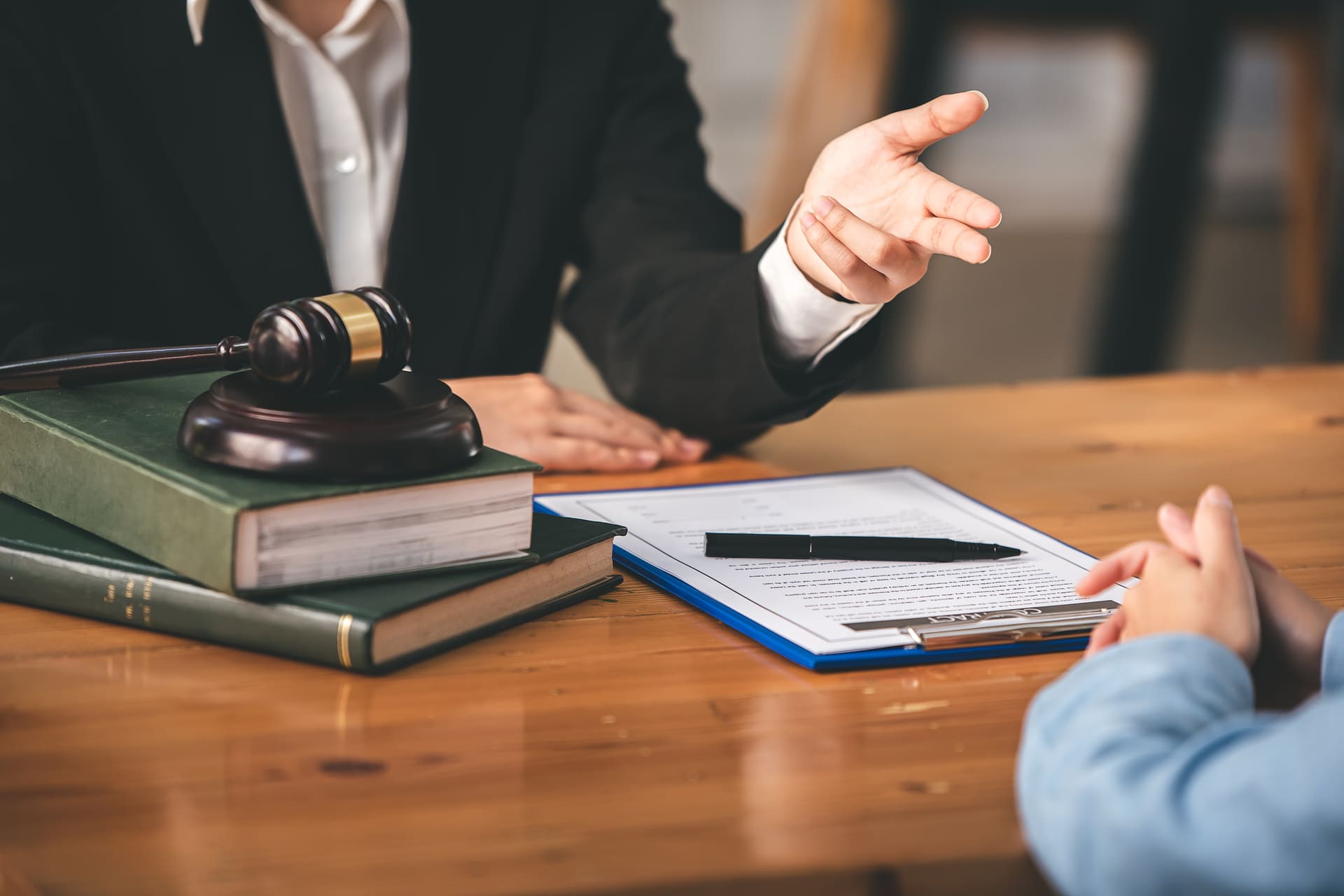 lawyer-consulting-with-client-on-legal-documents