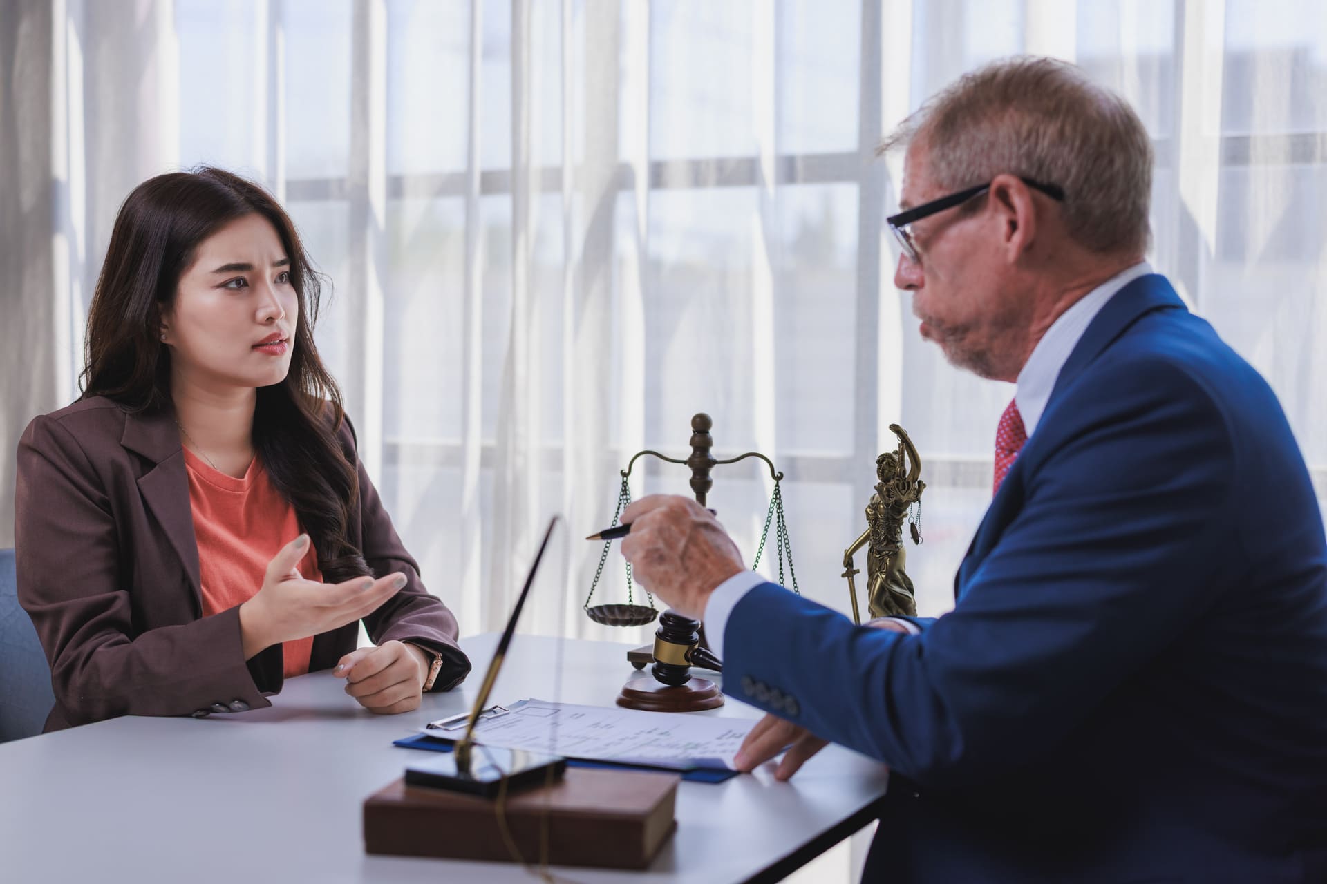lawyer-discussing-a-case-with-client-at-workplace