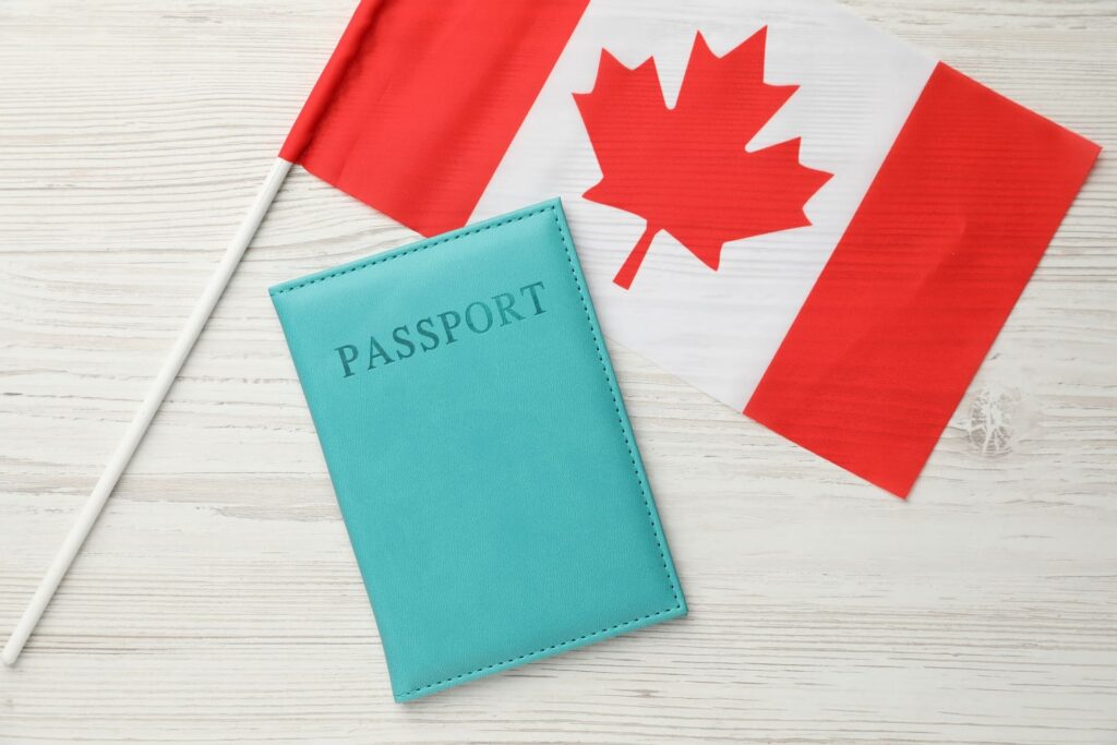 passport-cover-with-canadian-flag-on-white-table