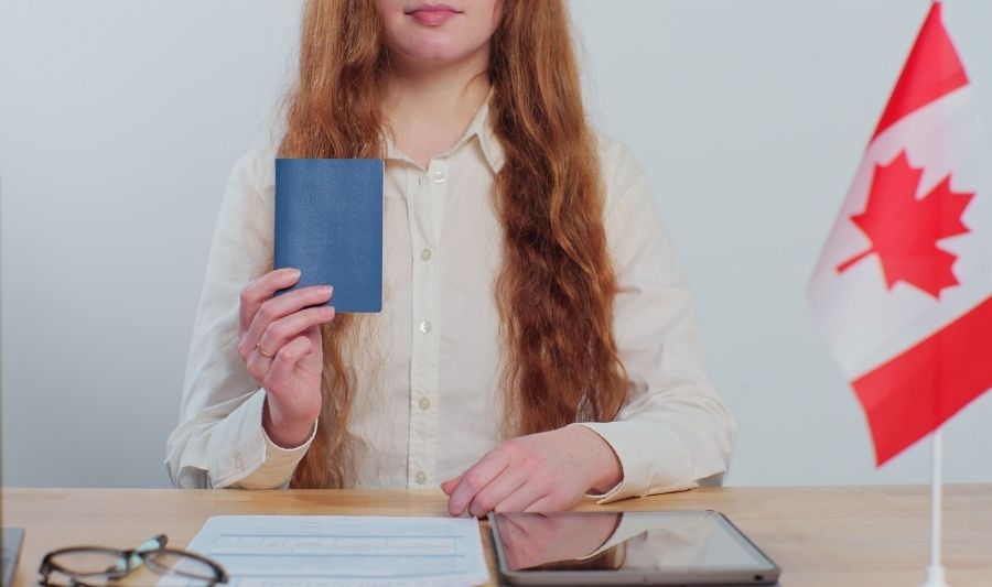 woman consular officer showing passport
